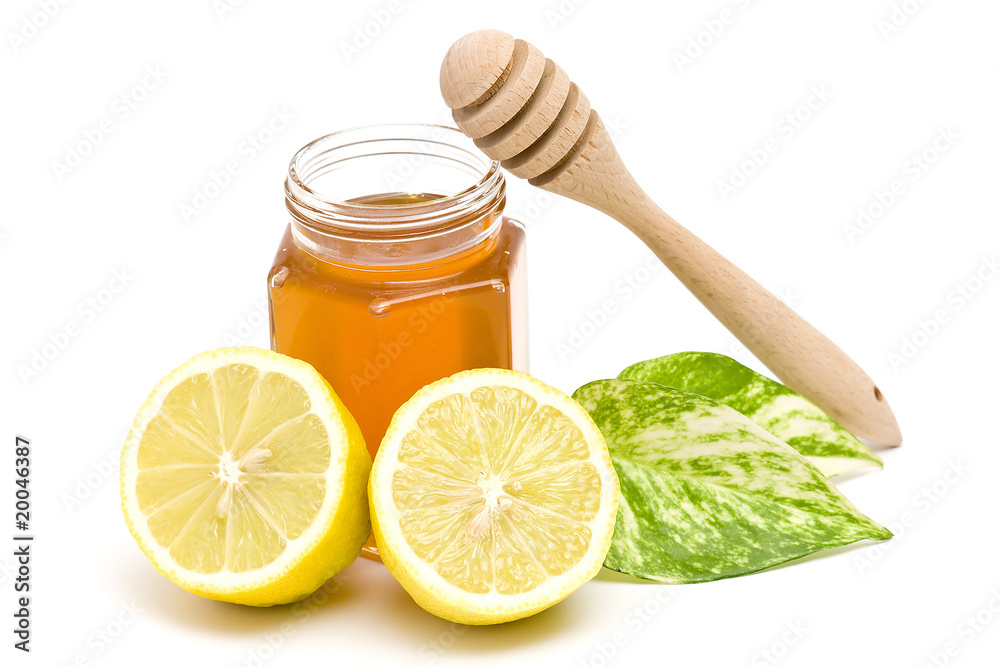 jar of honey, lemon and wooden drizzler jar of honey, lemon and wooden drizzler