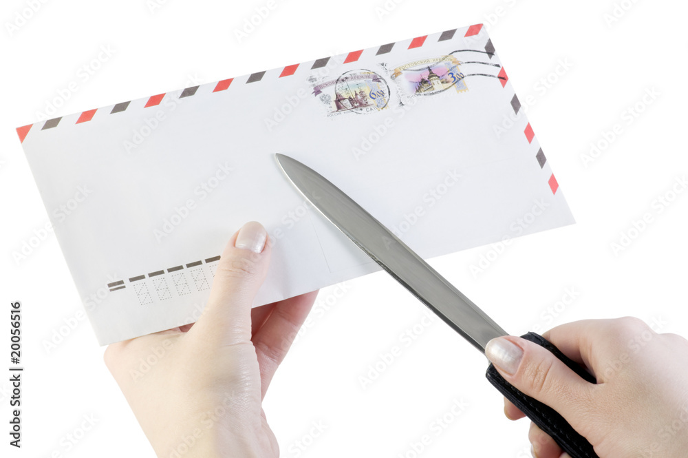 hand opens the envelope