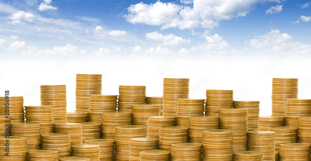 Golden coins against the blue sky