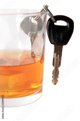 car keys inside bourbon glass