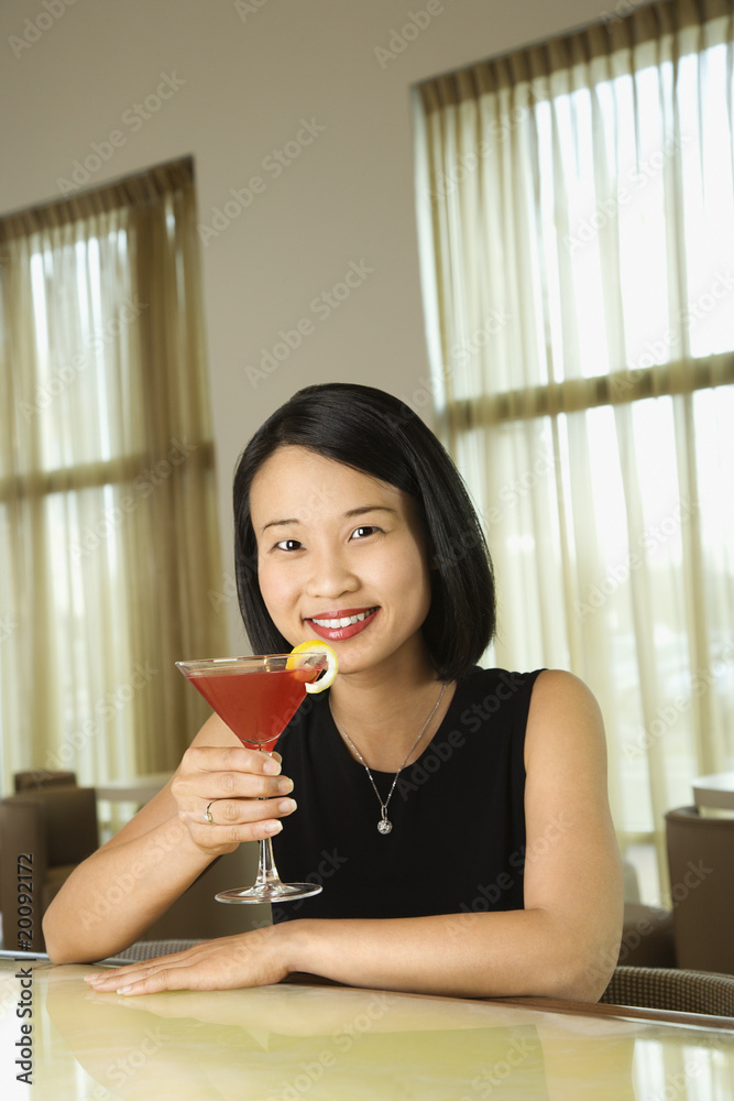 Attractive Young Woman Smiling with Beverage Attractive Young Woman Smiling with Beverage