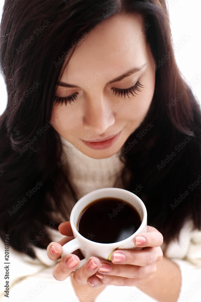 Portrait of a cheerful brunette holding coffee cup Portrait of a cheerful brunette holding coffee cup
