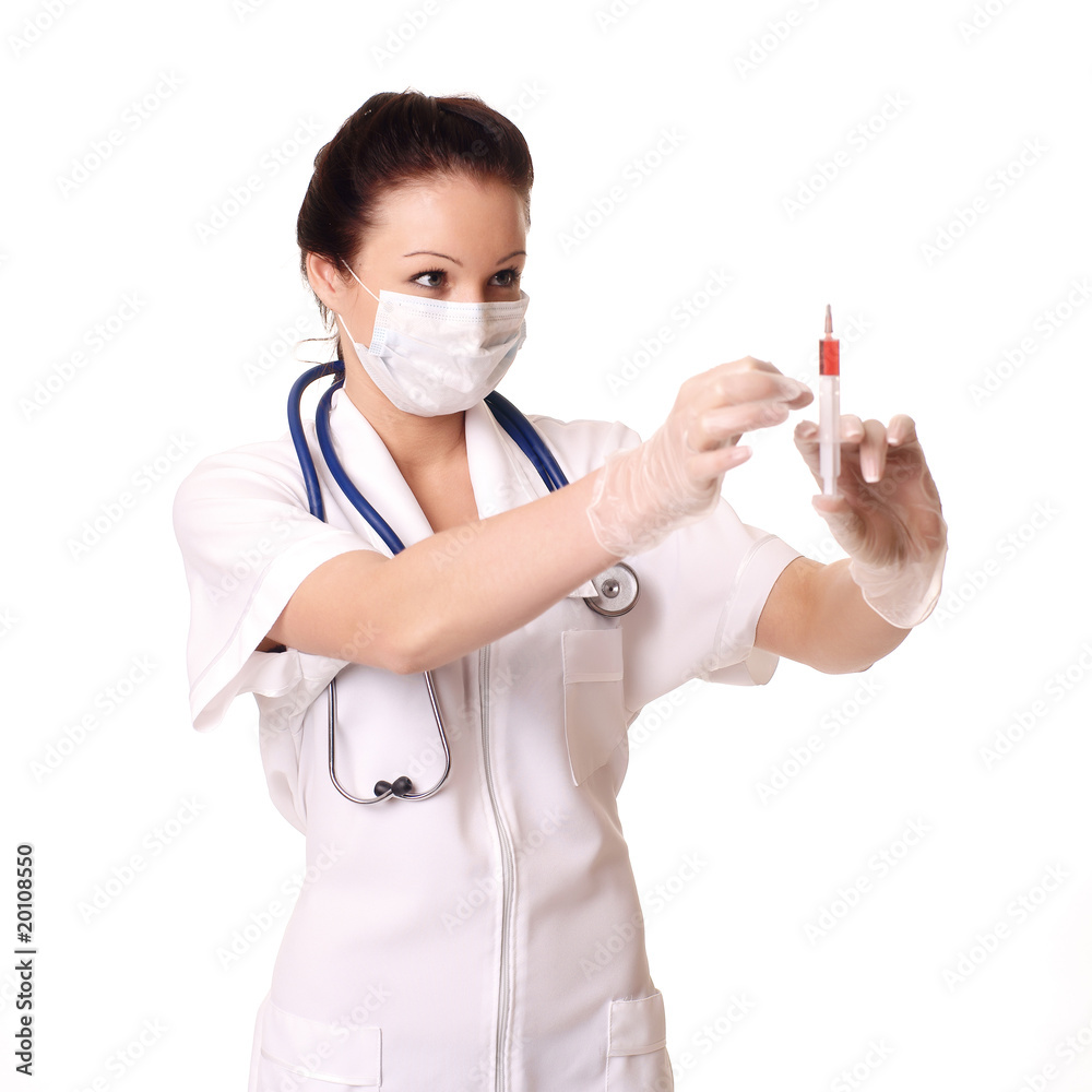 A young smiling doctor holding injection over white background A young smiling doctor holding injection over white background