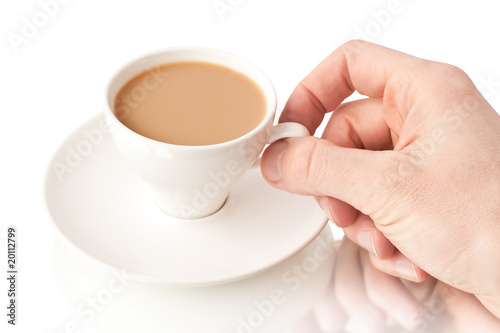 Coffee with milk and hand