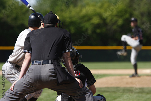 batter about to hit a pitch during a baseball game