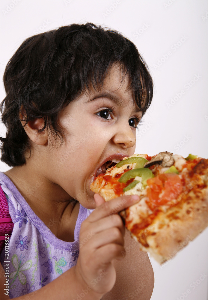 toddler enjoying pizza slice