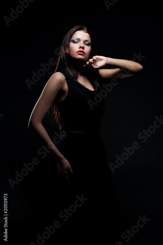 lovely young woman in darkness