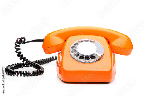Obraz na plátně A retro orange phone isolated on white background