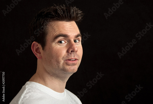 portrait of male in his 30's on black background