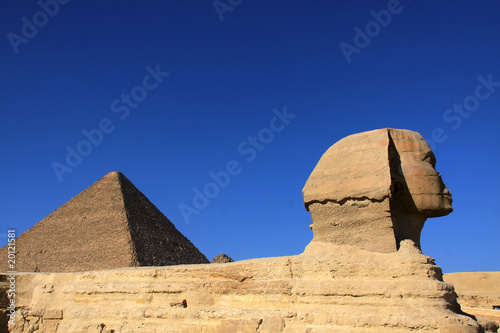 great ancient sculpture of egyptian sphinx and pyramid