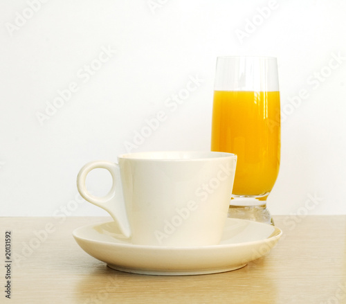 Cup of coffee with glass of juice