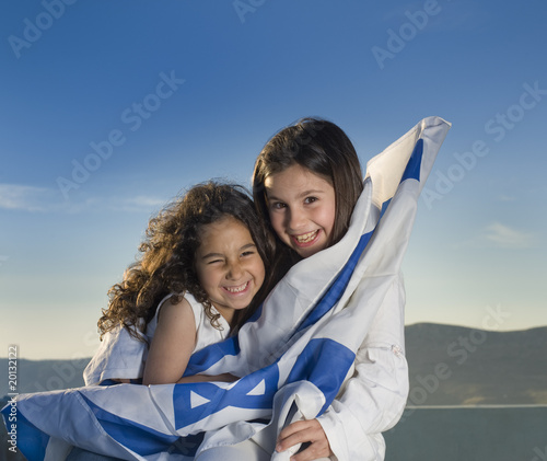 Принти на полотні two girls with the Israeli flag