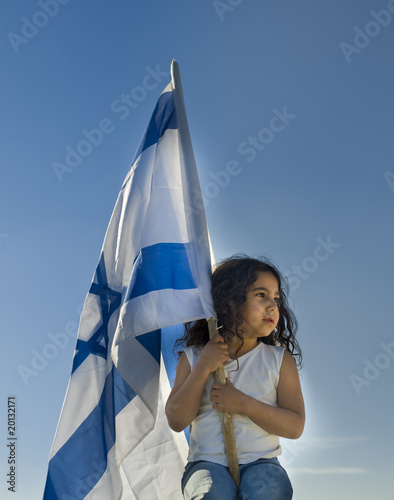 little girl holding the Israeli flag