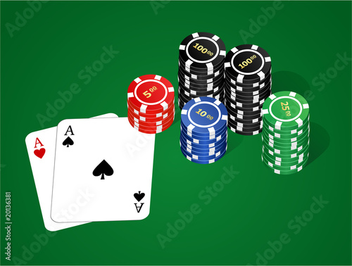 Poker chips and cards on the green background.