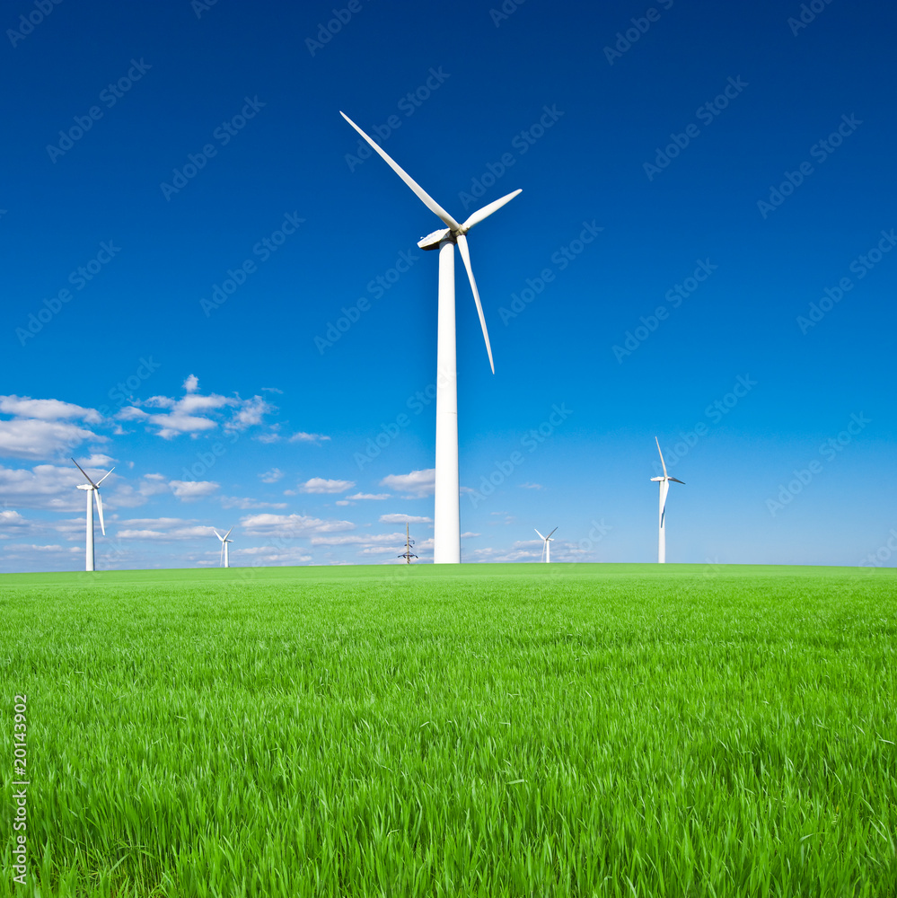 Wind power station - wind turbine against the blue sky Wind power station - wind turbine against the blue sky