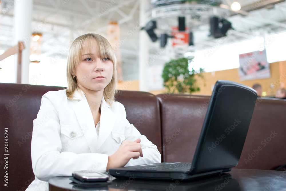 Young businesswoman with notebook in cafe Young businesswoman with notebook in cafe