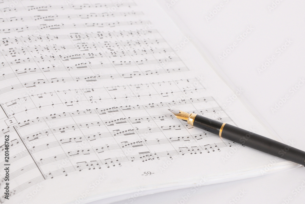 Pen on a musical notebook Pen on a musical notebook