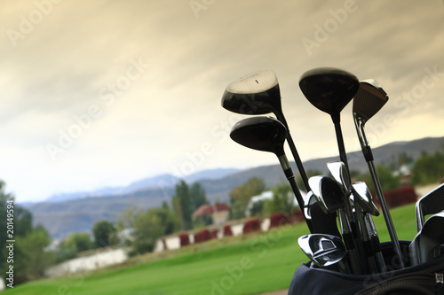 A set up new golf clubs on a beautiful golf course