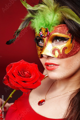 Fototapeta Naklejka Na Ścianę i Meble -  Girl with red  rose and mask.