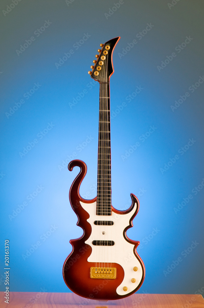 Obraz premium Wood guitar against gradient background