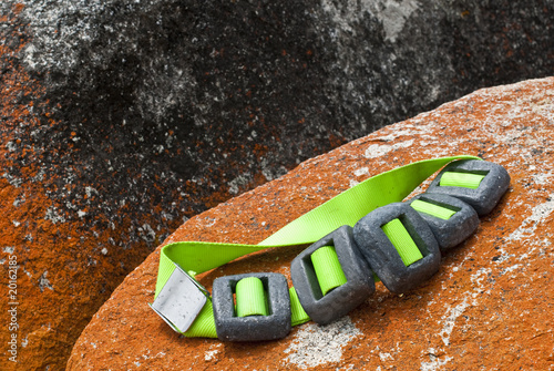 Scuba diver's lead weight belt on granite rock