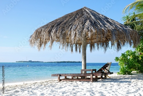 Two chairs and umbrella on the beach