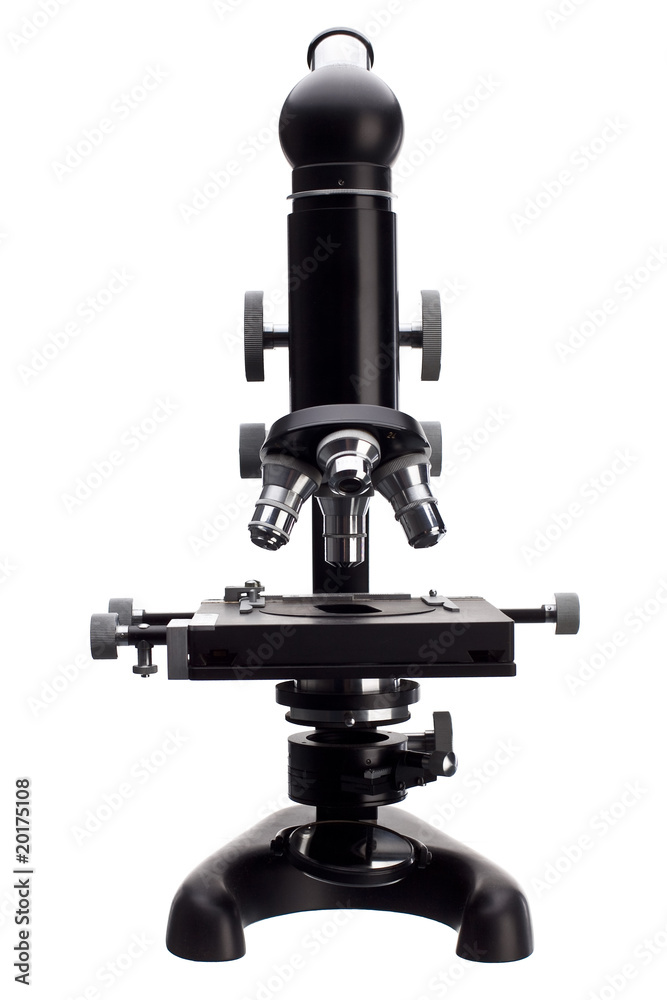 old microscope on white old microscope on white