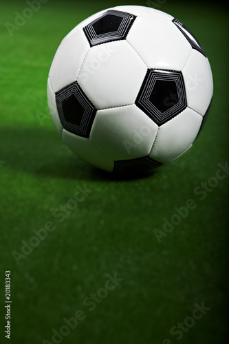 Soccer ball on green grass © ZoomTeam