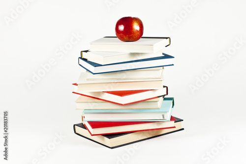 Pile of Books and Red Apple