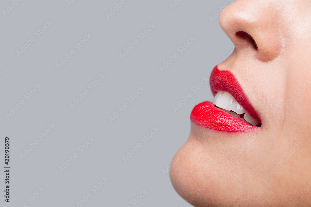 Naklejka premium Close up red lips and teeth.