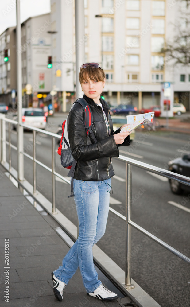 Young woman with city map in hands Young woman with city map in hands