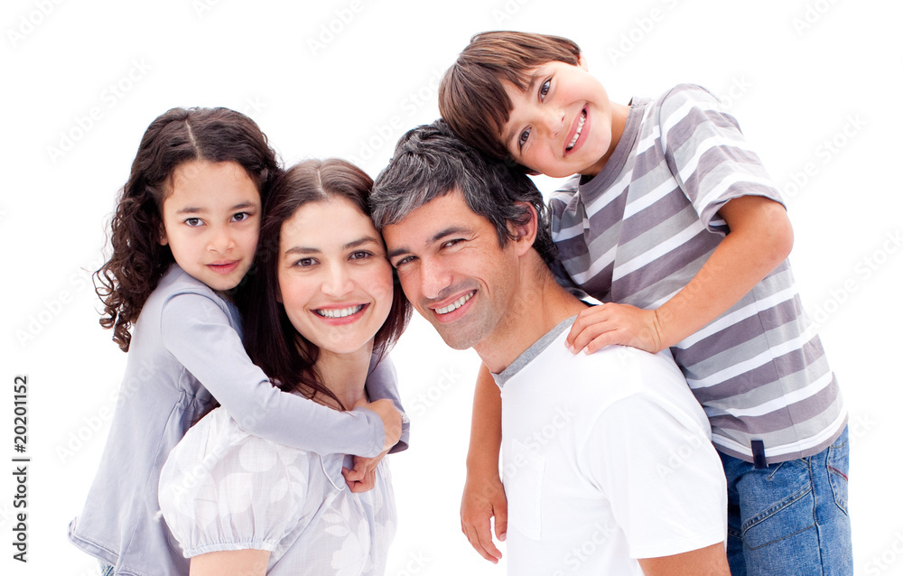 Smiling parents giving their children a piggyback ride Smiling parents giving their children a piggyback ride