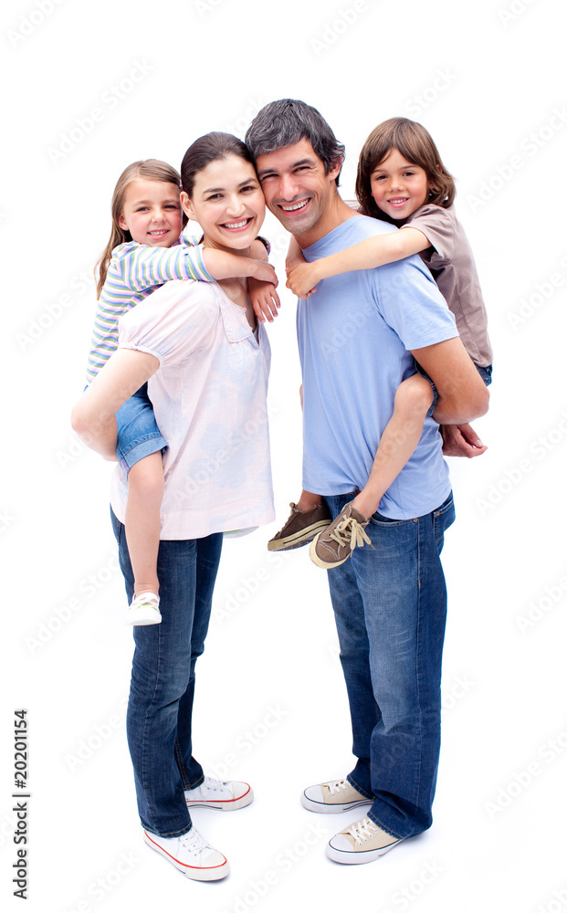 Jolly parents giving their children a piggyback ride Jolly parents giving their children a piggyback ride