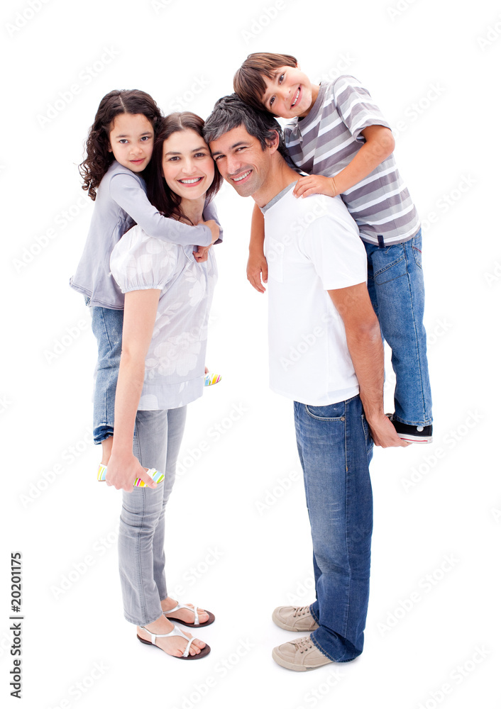 Affectionate parents giving their children a piggyback ride Affectionate parents giving their children a piggyback ride