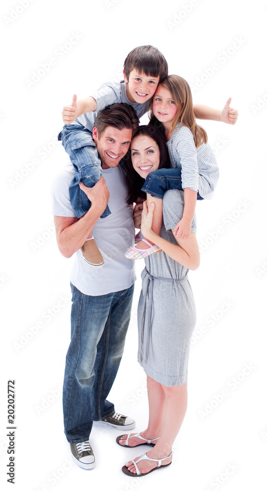 Jolly parents giving their children piggyback ride Jolly parents giving their children piggyback ride