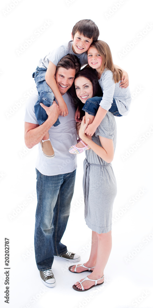Cheerful parents giving their children piggyback ride Cheerful parents giving their children piggyback ride