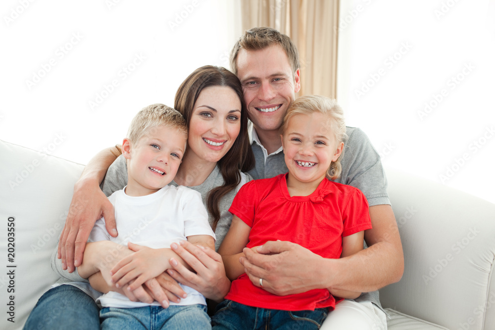 Portrait of Happy family sitting on sofa