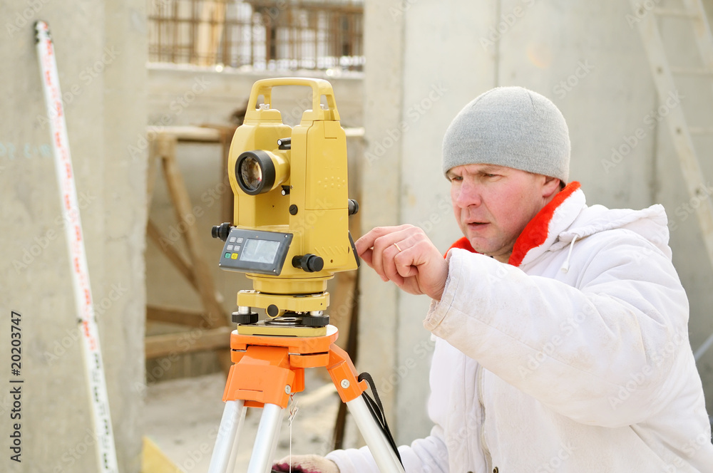 surveyor worker at construction site