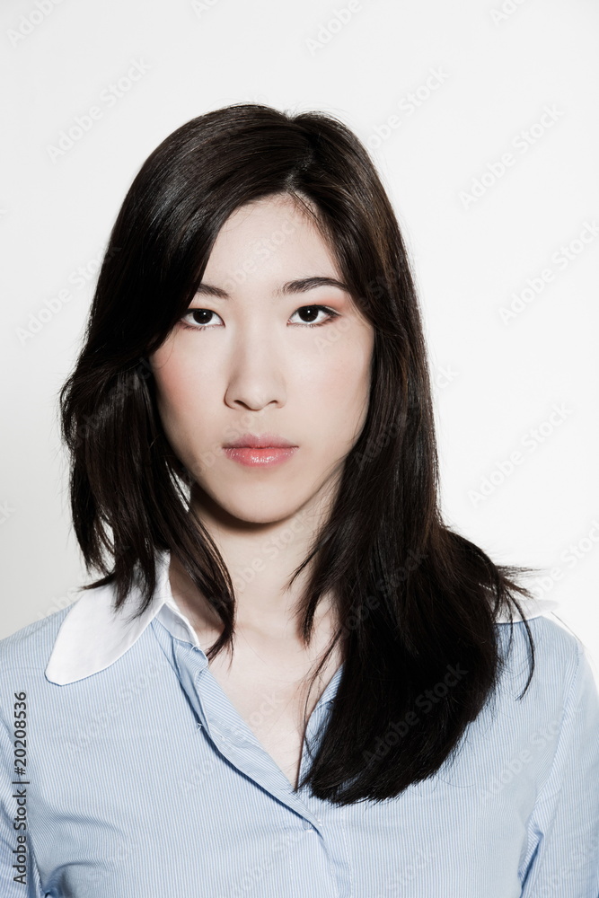 studio shot portrait of a beautiful serious asian young woman studio shot portrait of a beautiful serious asian young woman