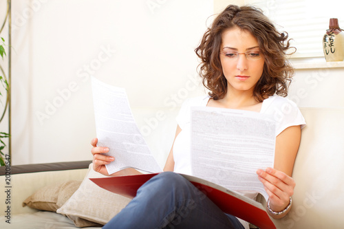 businesswoman at home doing paperwork