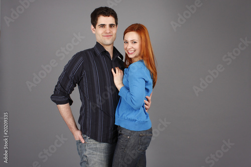 Happy young couple in casual clothes.