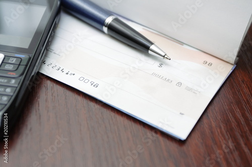 Business concept with check on a desk