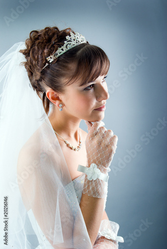 Beauty young bride dressed in  wedding dress photo