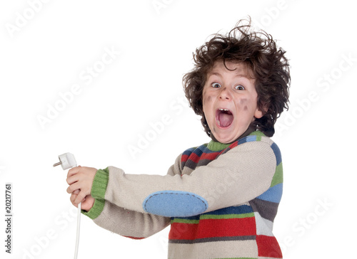 Obraz na plátně Child plug receiving electric shock