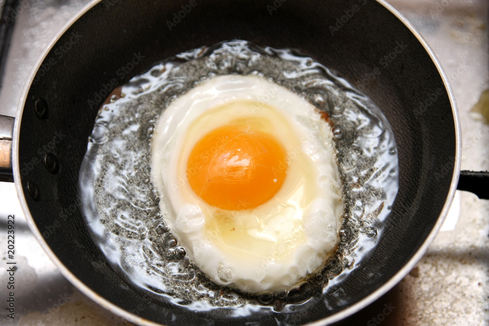 beautiful and tasty Fried egg in a frying pan beautiful and tasty Fried egg in a frying pan