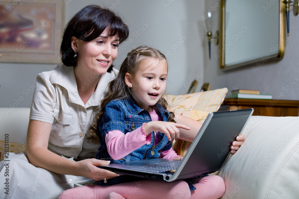 daughter and mom surfing internet daughter and mom surfing internet
