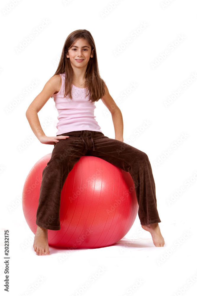 Young Girl On An Exercise Ball, Physically Fit Young Girl On An Exercise Ball, Physically Fit