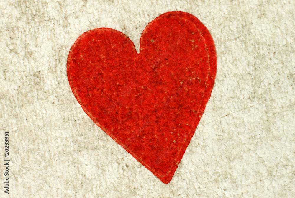Macro close up of a heart on a vintage playing card.