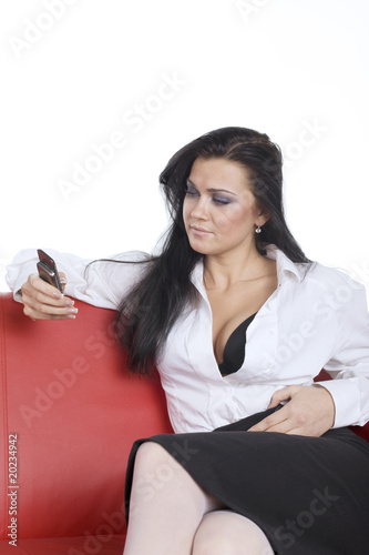 woman with open decollete look at phone