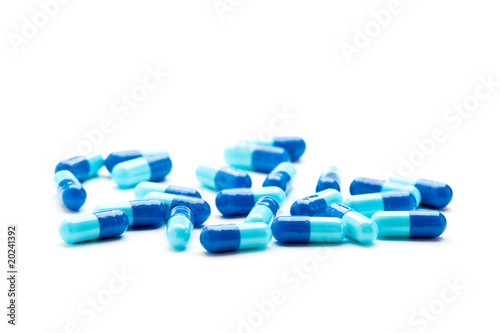 Fotografía Blue gelcaps on white surface